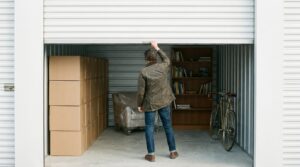 Person closing a neatly packed storage unit